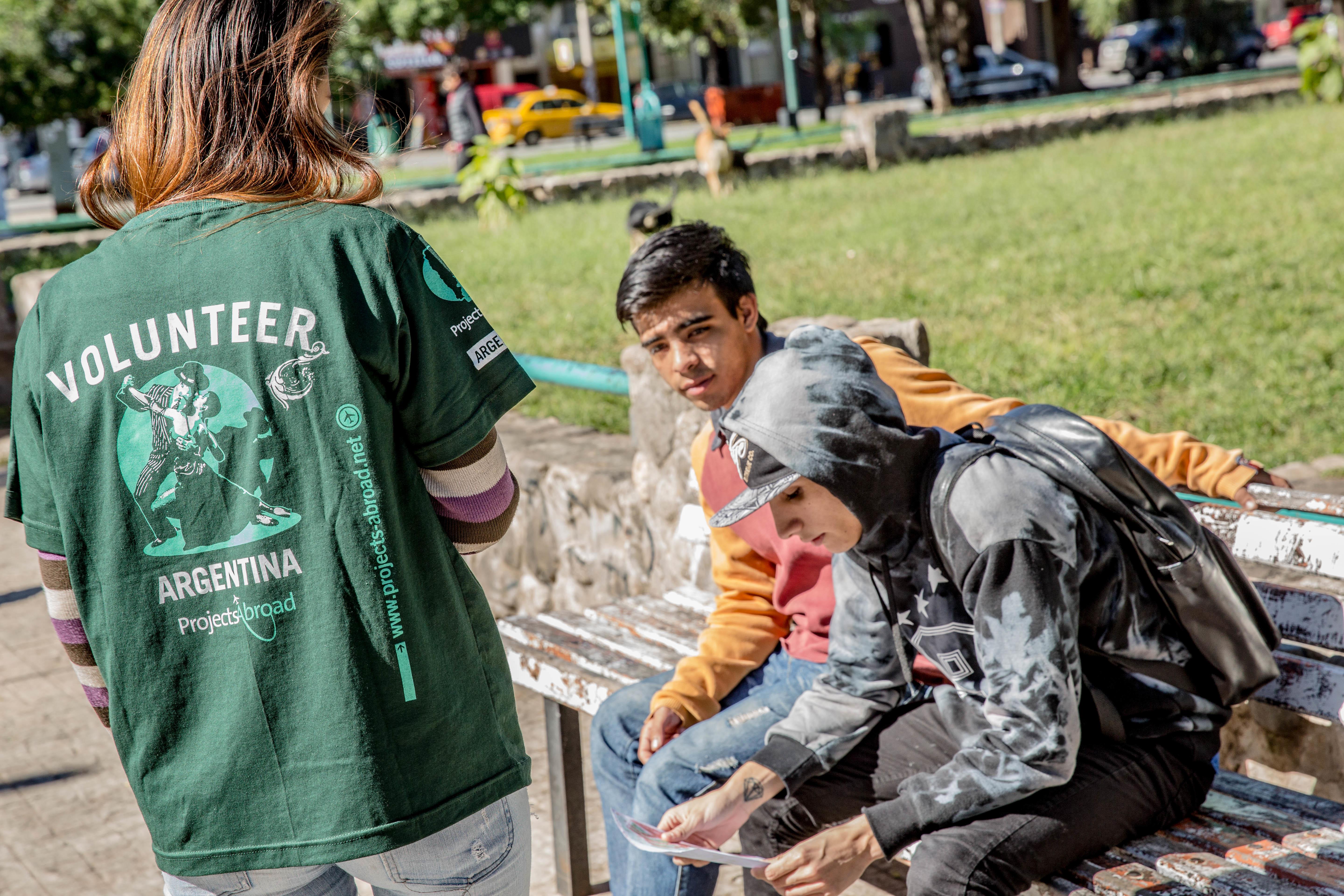 A Projects Abroad intern hands out flyers on her Human Rights internship for high school students in Argentina A teenager hands out flyers on her Human Rights internship in Argentina